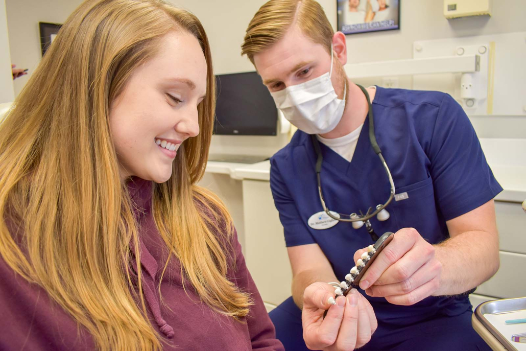 Dentist at Hudson Family Dental With A Patient