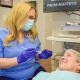 Hygienist and patient at Hudson Family Dental. Family dental care concept.