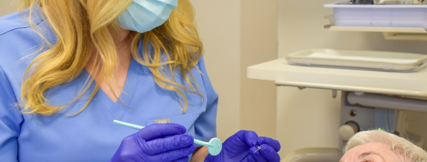 Hygienist and patient at Hudson Family Dental. Family dental care concept.