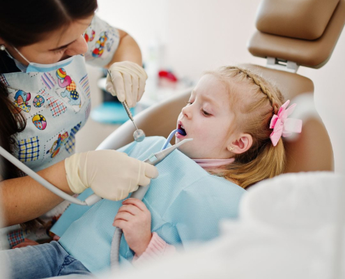 Little girl getting a teeth cleaning at Hudson Family Dental.