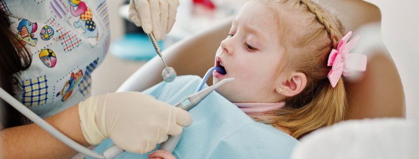 Little girl getting a teeth cleaning at Hudson Family Dental.