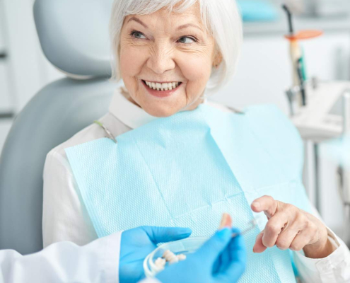 Senior lady doing dental care Hudson MA.