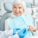 Senior lady doing dental care Hudson MA.