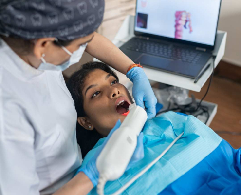 Patient having dental laser treatment.