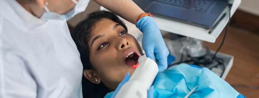 Patient having dental laser treatment.